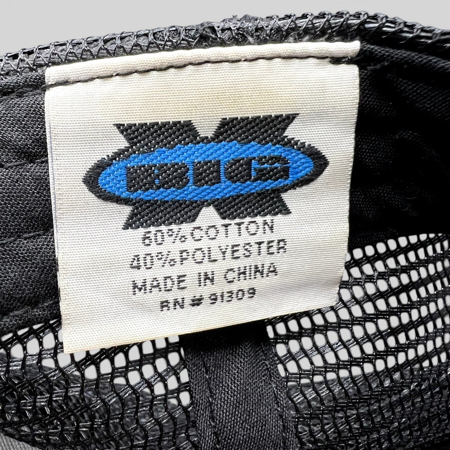 Raree Finds ATLWOOD trucker hat interior fabric care label showing cotton polyester blend and origin details