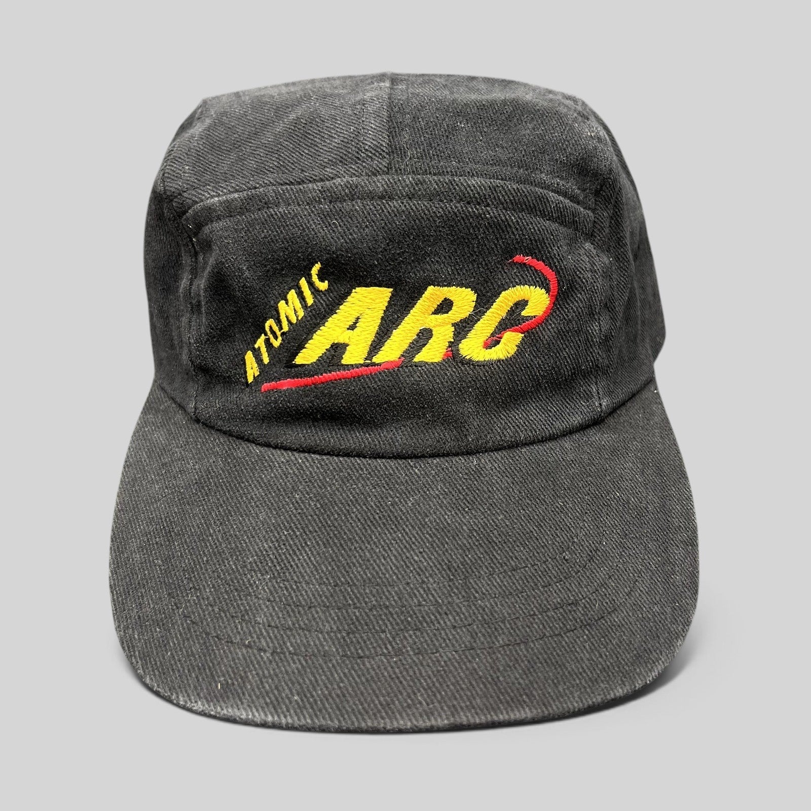 Raree Finds vintage black cotton Atomic ARC strapback hat with yellow and red embroidered logo