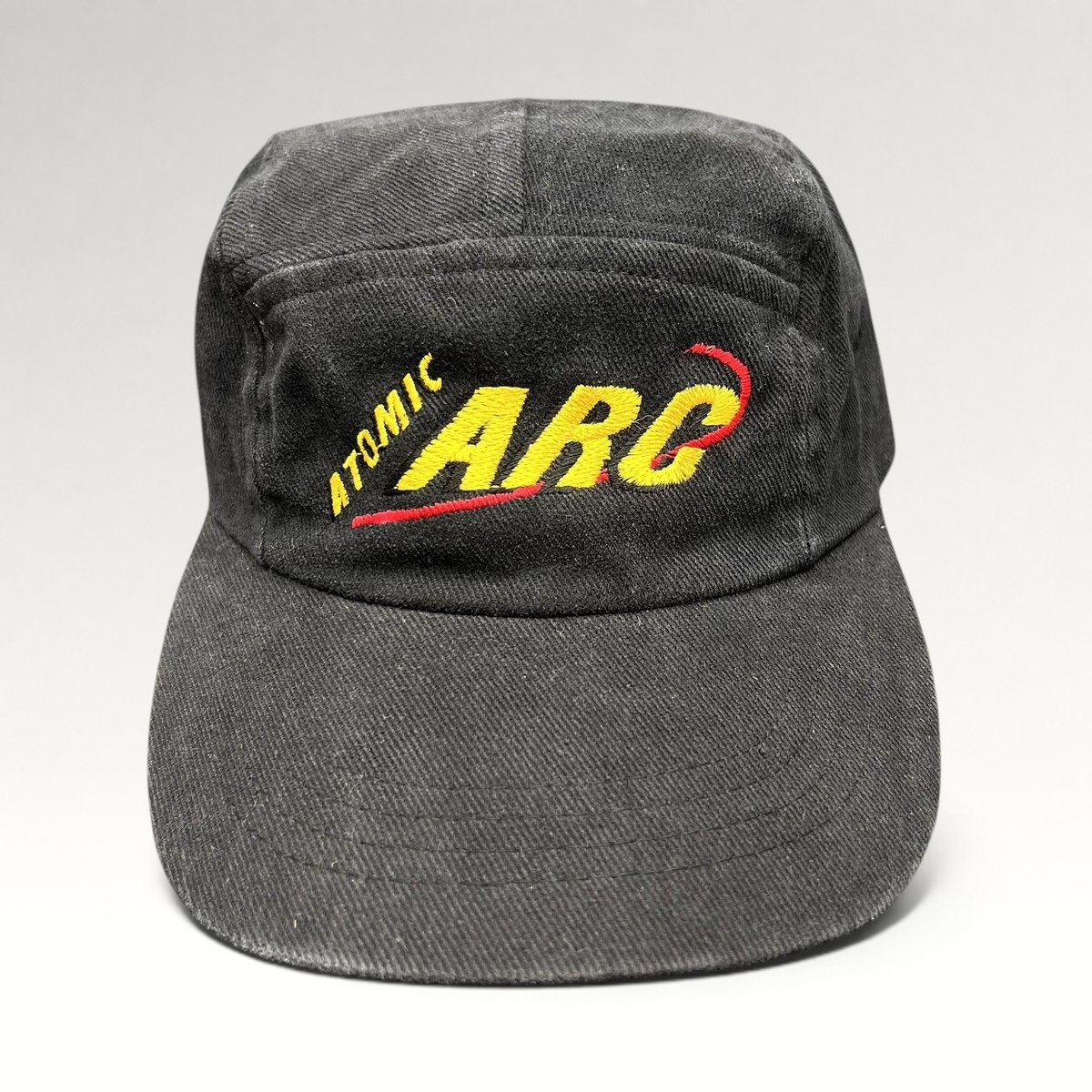 Raree Finds vintage black cotton Atomic ARC strapback hat with yellow and red embroidered logo
