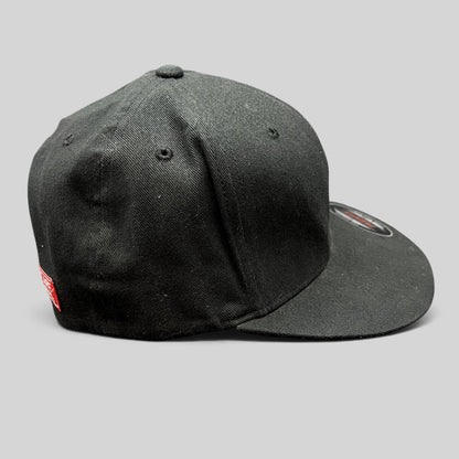 Raree Finds black Atomic Skis FlexFit cap with a flat brim and side profile view.
