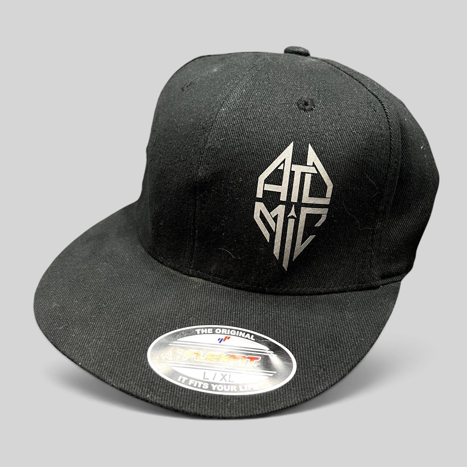 Raree Finds black Atomic Skis FlexFit cap with embroidered logo on the front and flat brim design