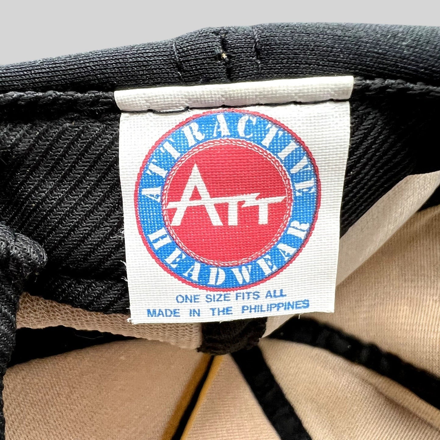 Raree Finds vintage Attractive Headwear label inside a black ARCO Marine snapback hat made in the Philippines