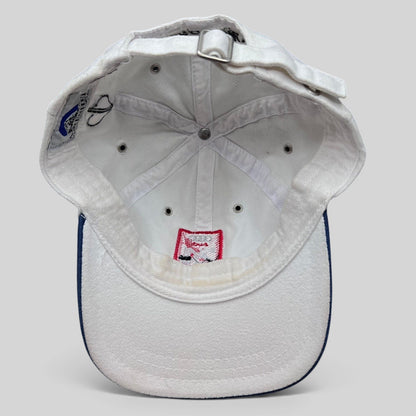 Raree Finds vintage white Audi 24 HRS of Aspen cotton strapback hat, interior view showing metal eyelets and branding.