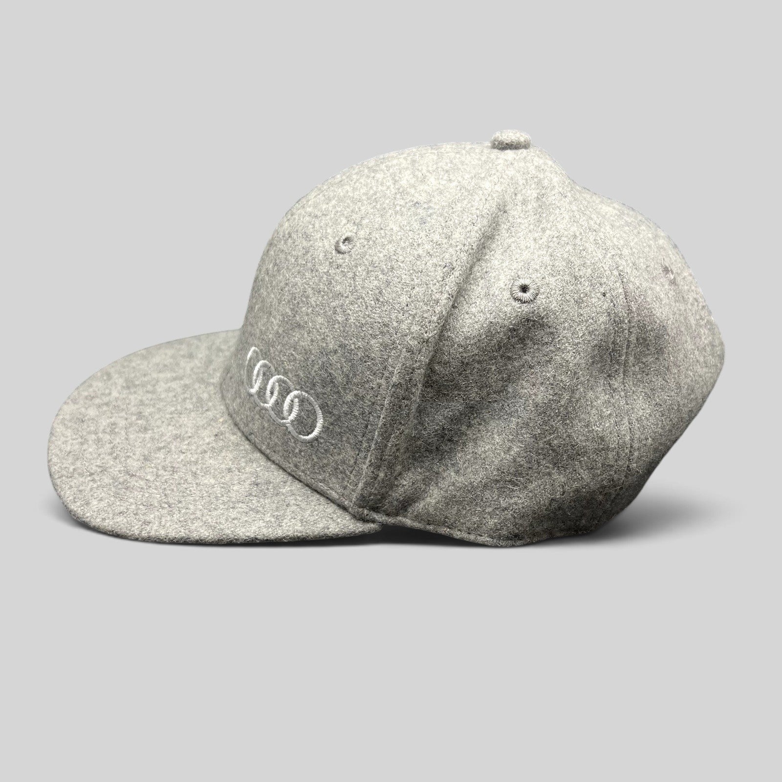 Raree Finds gray felted wool-blend Audi snapback hat with embroidered four rings logo and structured six-panel design.
