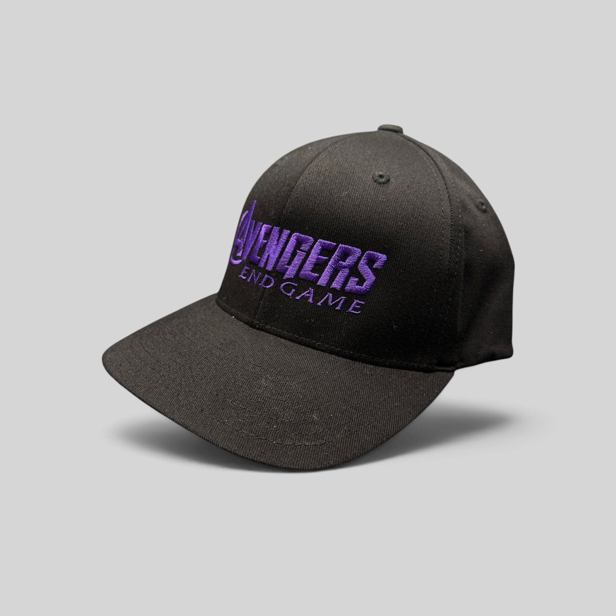 Raree Finds Avengers Endgame cast and crew Flexfit hat with purple logo embroidery on a black crown