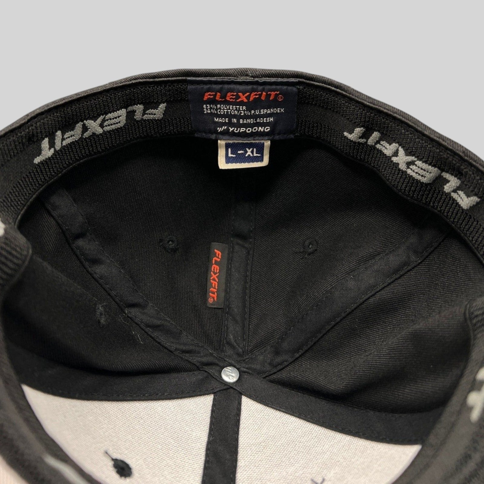 Raree Finds Avengers Endgame cast and crew Flexfit hat interior showing official Marvel Studios branding and size tag