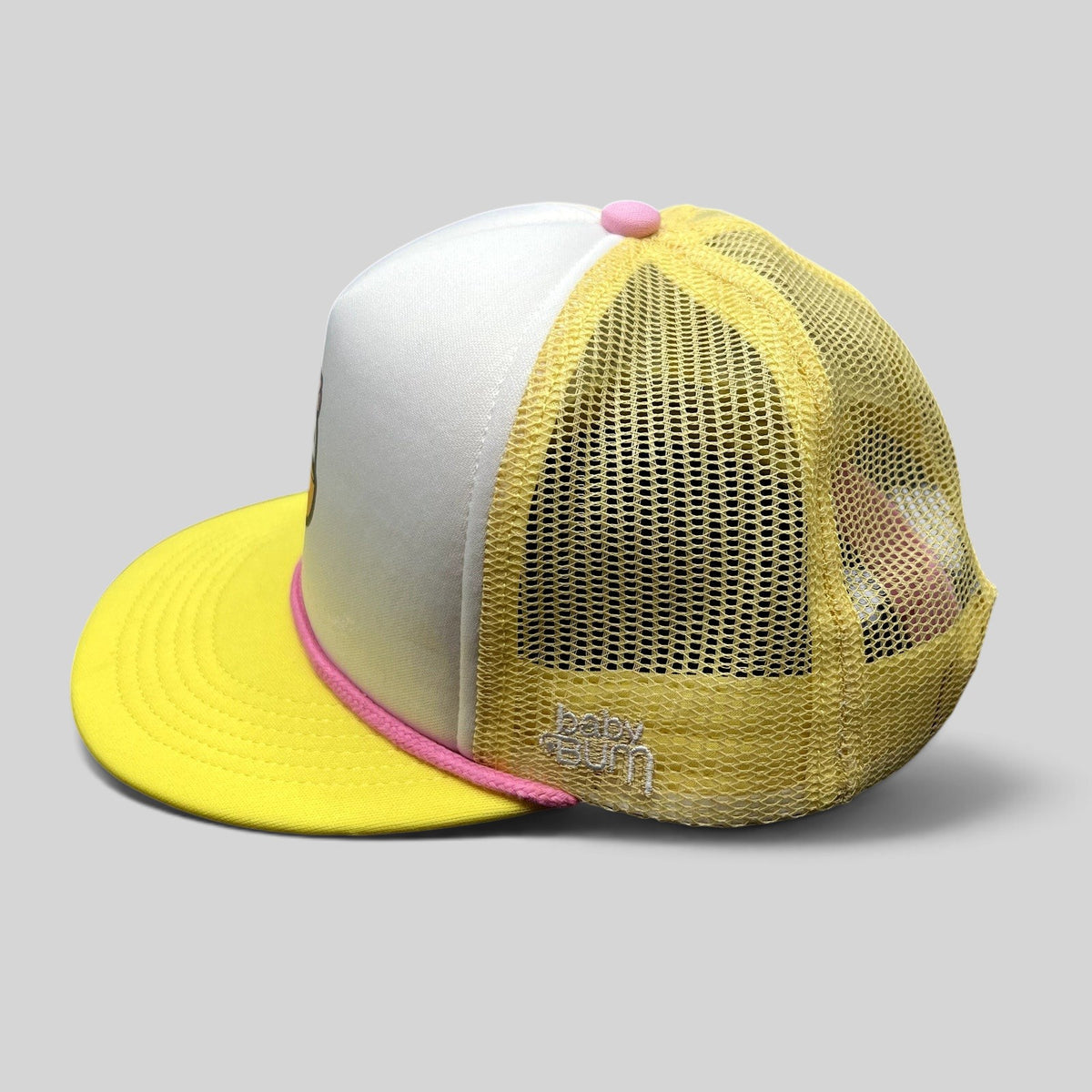 Raree Finds Baby Bum prototype trucker hat with yellow mesh back, white foam front, pink rope trim, and snapback.