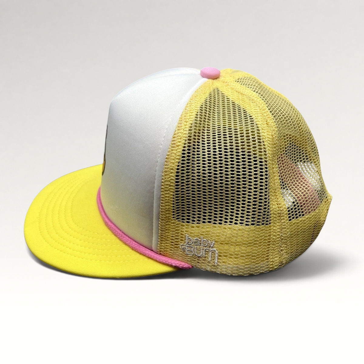 Raree Finds Baby Bum prototype trucker hat in yellow and white with pink rope trim and mesh back panels