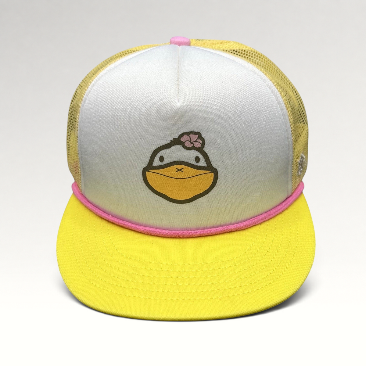 Raree Finds Baby Bum prototype trucker hat with white foam front, yellow mesh back, pink rope trim, and duck graphic.