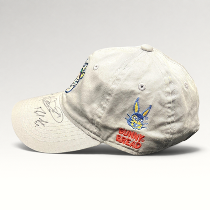 Raree Finds cream cotton New Orleans Baby Cakes strapback hat with Bunny Bread embroidery and signed brim