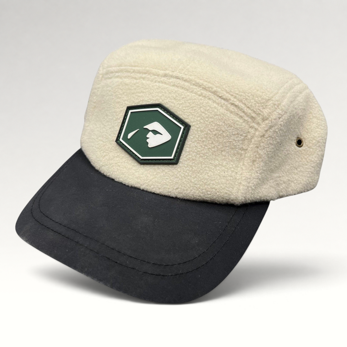 Raree Finds Baldface cream fleece strapback hat with a black bill and green rubber logo patch
