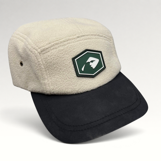 Raree Finds Baldface strapback hat with a cream fleece crown, black bill, and a green rubber logo patch.