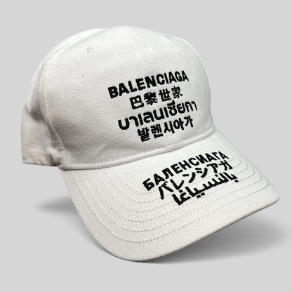 Raree Finds white cotton strapback hat with black multilingual Balenciaga logo embroidery on front and brim