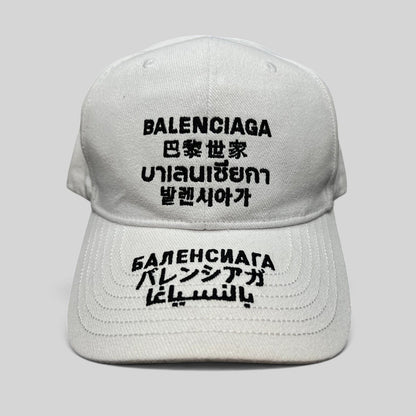 Raree Finds white cotton strapback hat with black multilingual Balenciaga logo embroidery on front and brim
