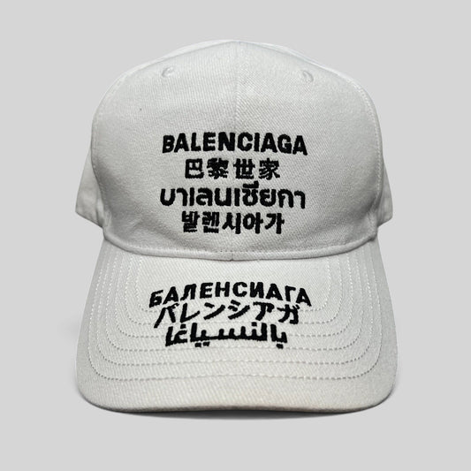 Raree Finds white cotton strapback hat with black multilingual Balenciaga logo embroidery on front and brim