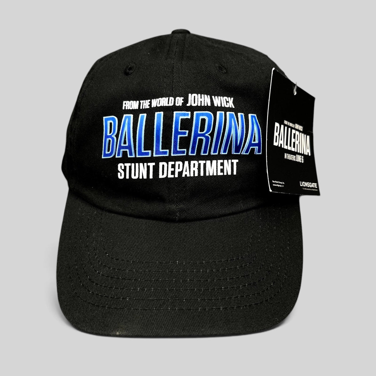 Raree Finds black cotton strapback hat with Ballerina Stunt Department embroidery and official Lionsgate hang tag.