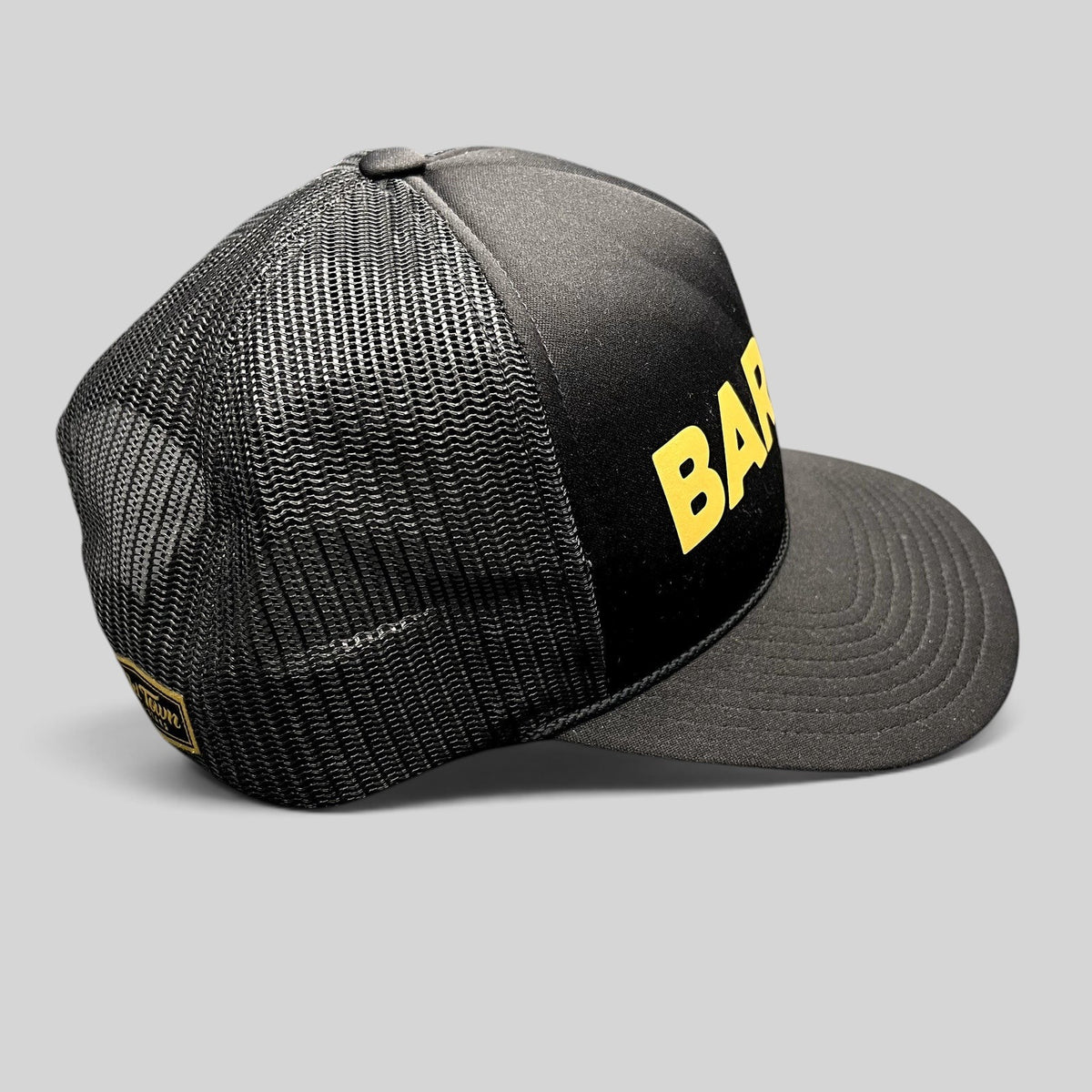 Raree Finds black and gold Barre Vermont trucker snapback hat with mesh back panels and bold yellow lettering