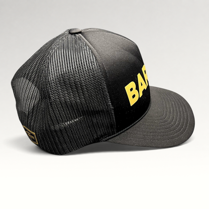 Raree Finds black and gold Barre Vermont trucker snapback hat with mesh back panels and bold yellow lettering.