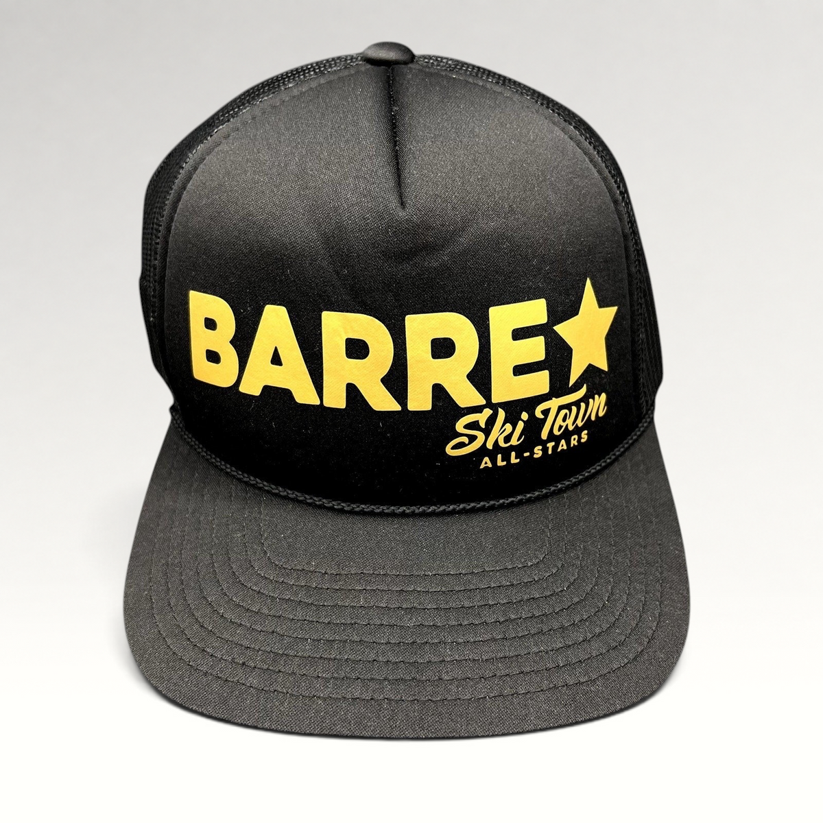 Raree Finds black trucker snapback hat with gold Barre Vermont and Ski Town All-Stars lettering and mesh back panels.