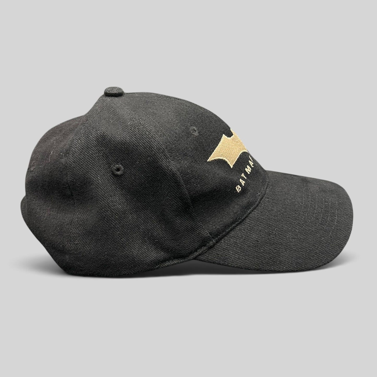 Raree Finds vintage 2005 Batman Begins black cotton strapback hat with gold embroidered bat symbol and film title