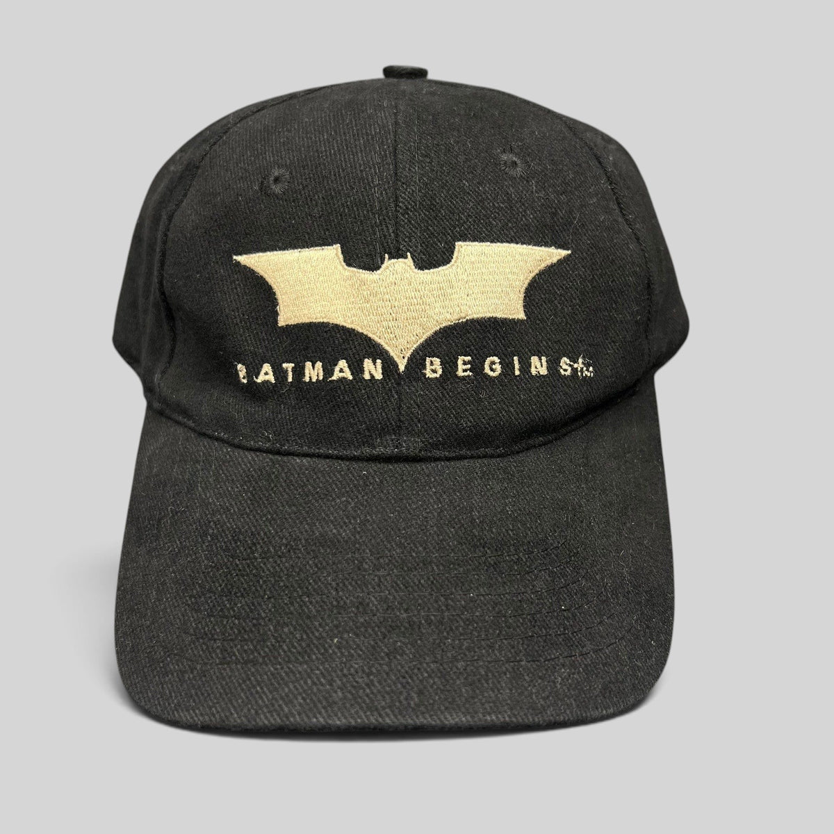 Raree Finds vintage 2005 Batman Begins black cotton strapback hat with gold embroidered bat symbol and movie logo