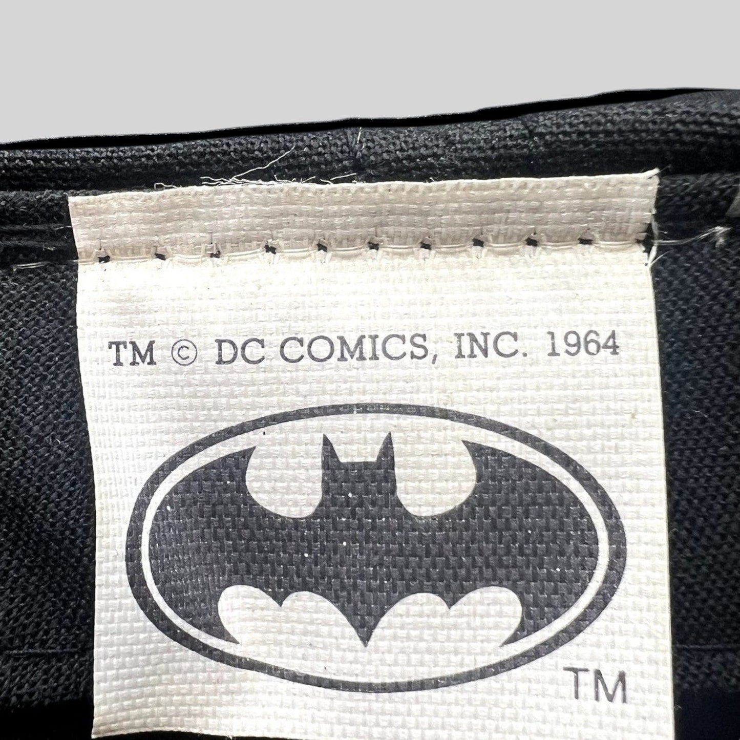 Raree Finds vintage Batman DC Comics cap interior tag with 1964 copyright logo on black fabric