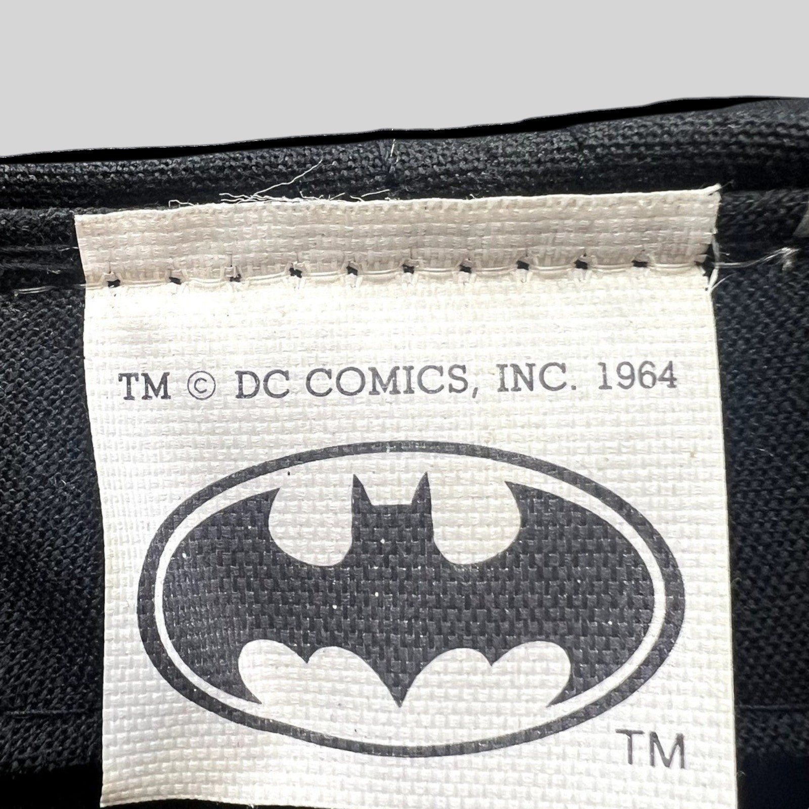 Raree Finds vintage Batman DC Comics cap interior tag with 1964 copyright logo on black fabric