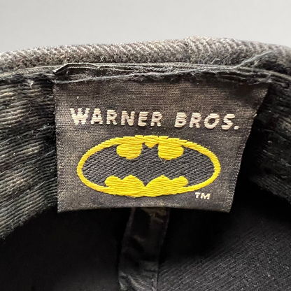 Raree Finds vintage Warner Bros Batman hat interior tag with yellow and black embroidered logo on black fabric