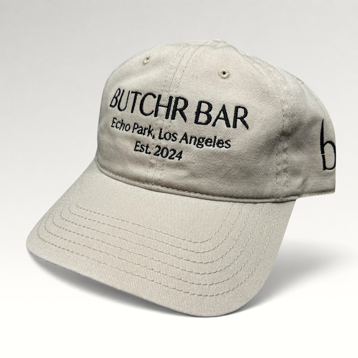 Raree Finds beige cotton twill strapback dad hat with black Butchr Bar Echo Park Los Angeles embroidery