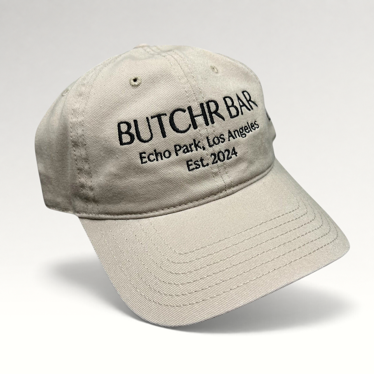 Raree Finds beige cotton twill strapback hat with black Butchr Bar Echo Park Los Angeles embroidery