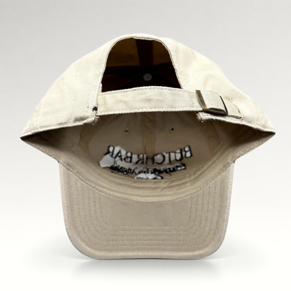 Raree Finds beige cotton twill strapback hat with adjustable fabric strap and antique brass buckle