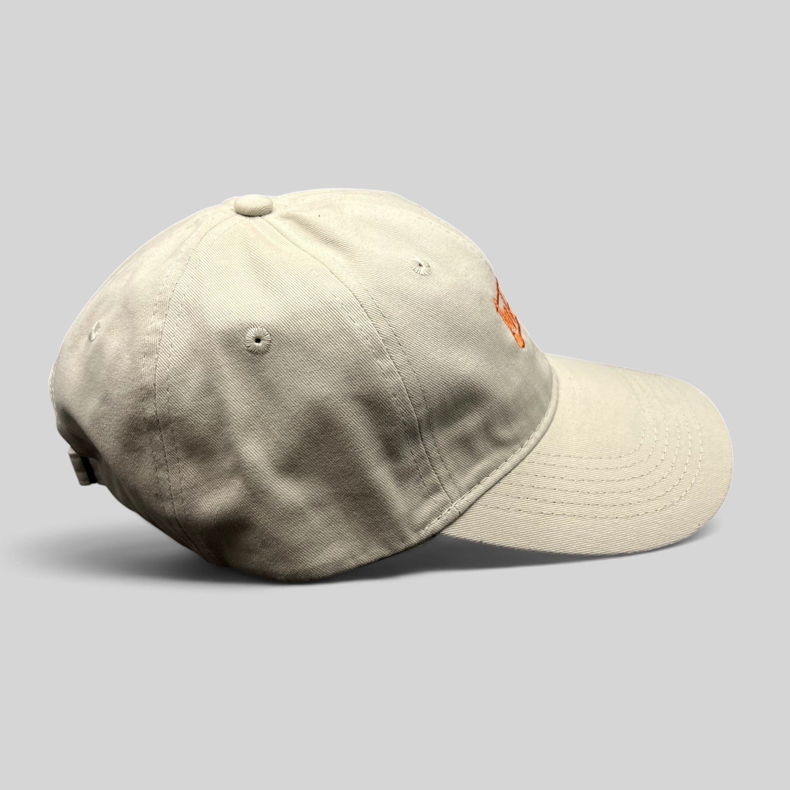 Raree Finds beige cotton strapback dad hat with orange Tuk Tuk Thai embroidery and a curved brim