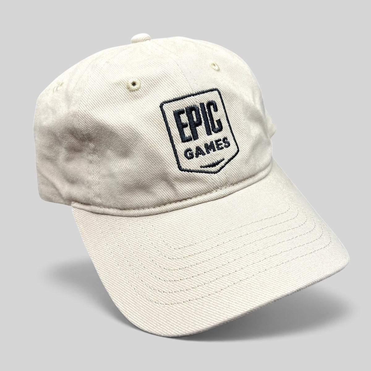 Raree Finds beige cotton twill dad cap with embroidered Epic Games shield logo and curved brim