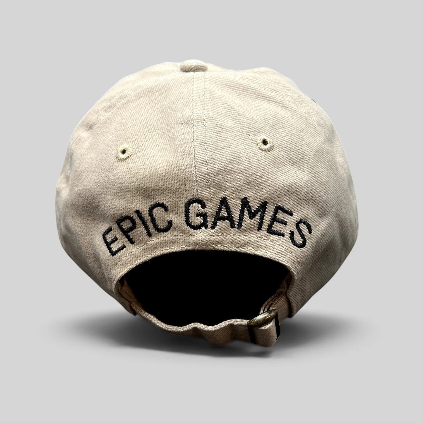 Raree Finds beige cotton twill dad cap with Epic Games logo embroidered on the back and adjustable strapback closure.