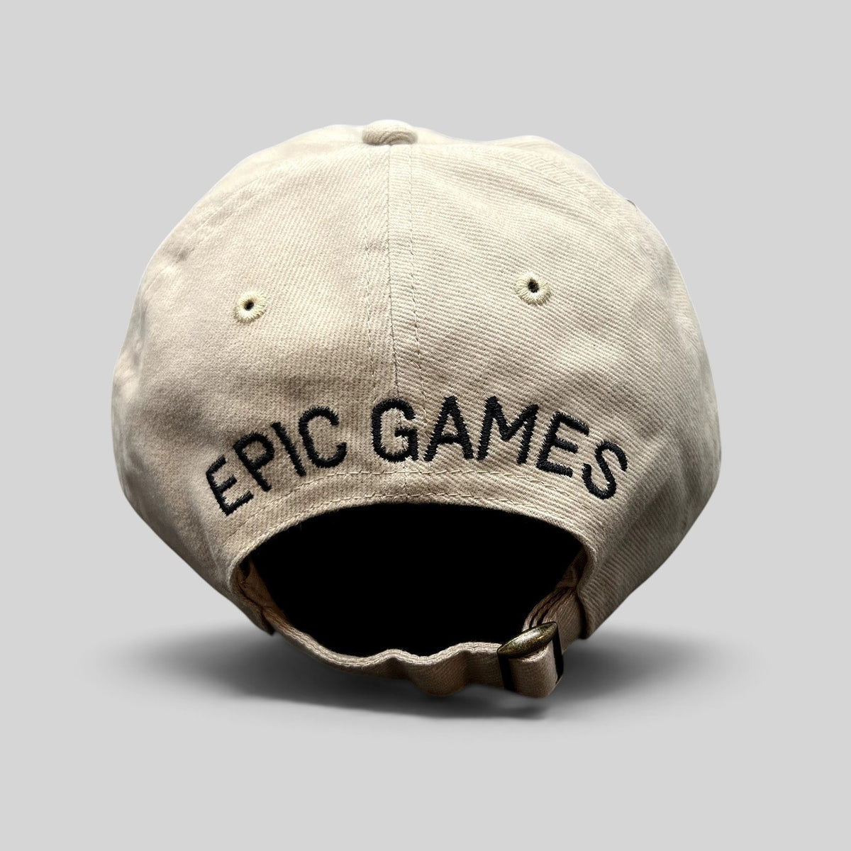 Raree Finds beige cotton twill dad cap with Epic Games logo embroidered on the back and adjustable strapback closure.