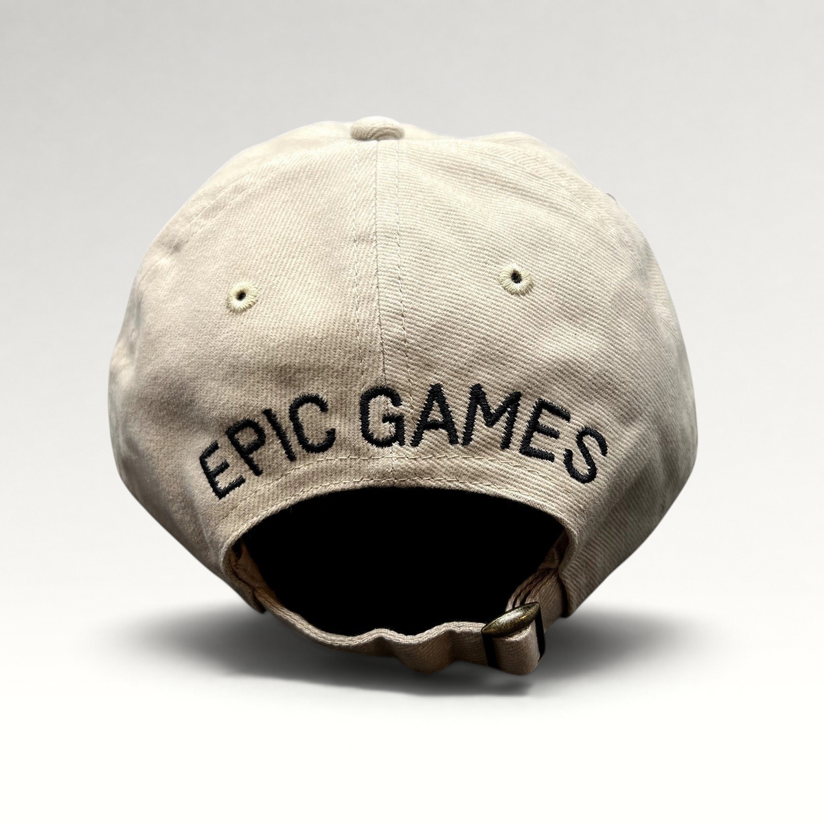 Raree Finds beige cotton twill dad cap with Epic Games logo embroidered on the back and adjustable strapback closure.