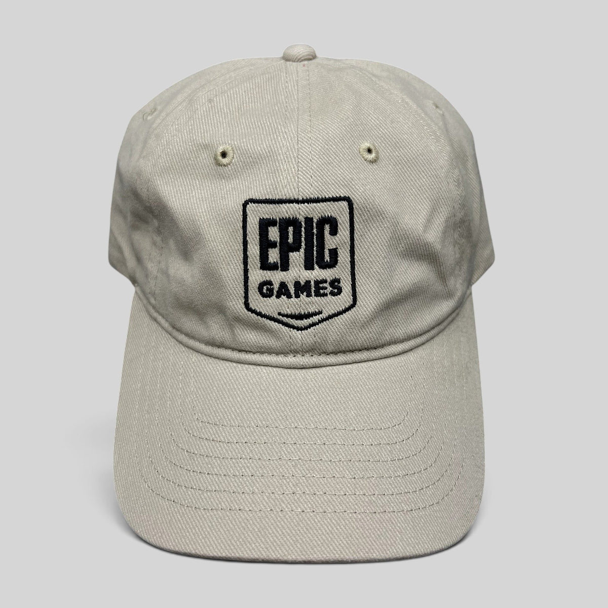 Raree Finds beige cotton twill dad cap with black embroidered Epic Games shield logo on the front