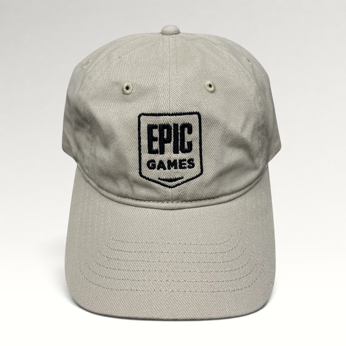 Raree Finds beige cotton twill dad cap with black embroidered Epic Games shield logo on the front