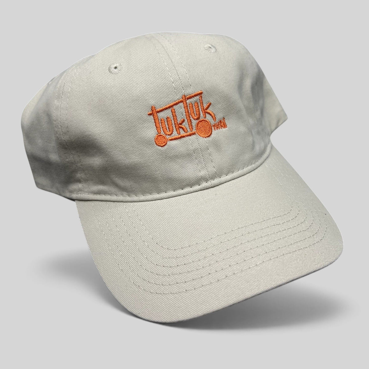 Raree Finds beige cotton strapback dad hat with orange Tuk Tuk Thai embroidered logo and curved brim