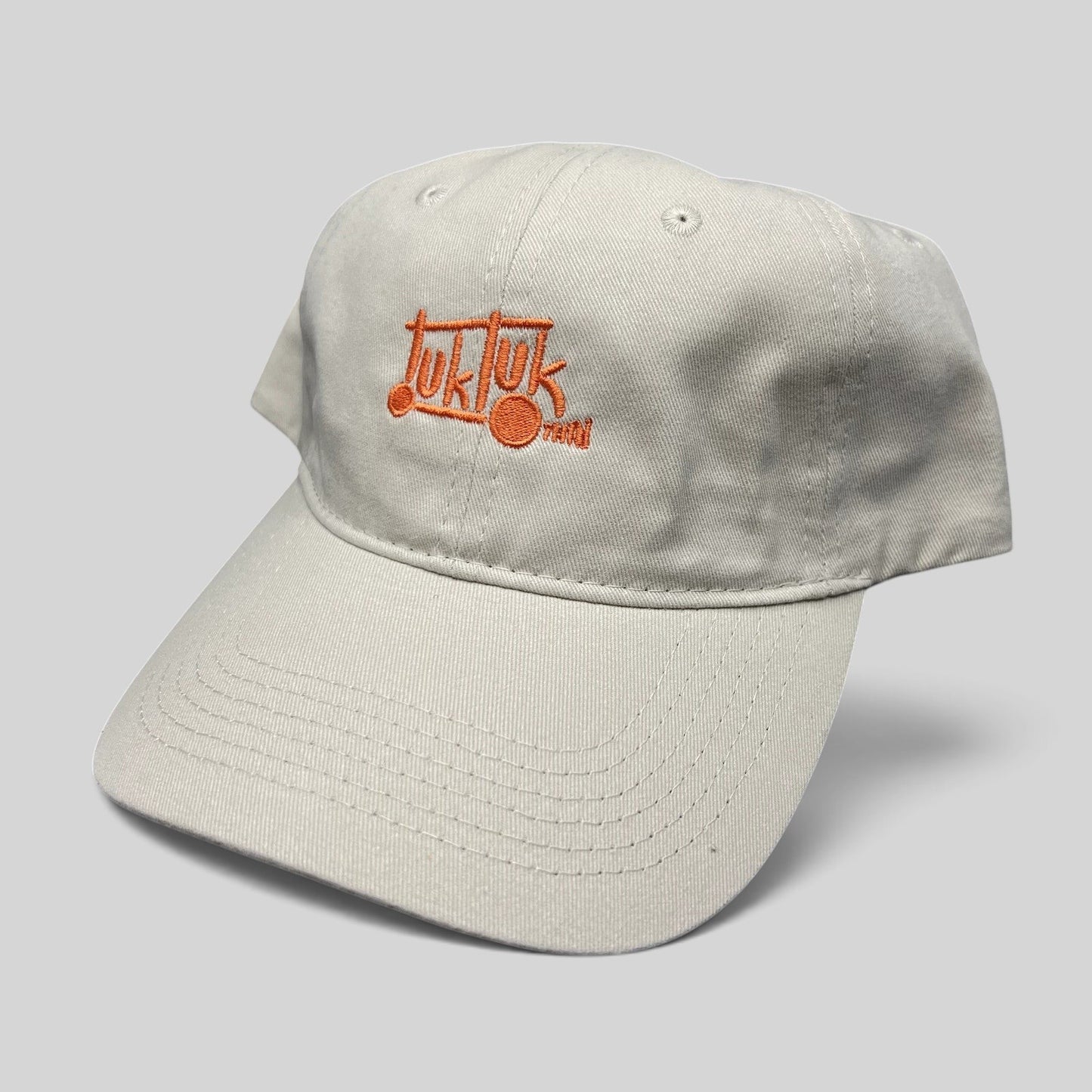 Raree Finds beige cotton strapback dad hat with orange Tuk Tuk Thai embroidered logo and curved brim