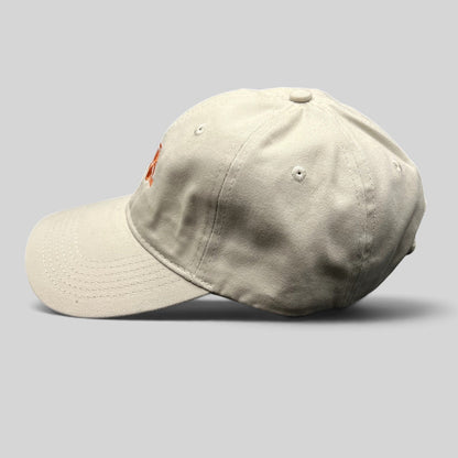 Raree Finds beige cotton strapback dad hat with orange Tuk Tuk Thai embroidery and curved brim side view