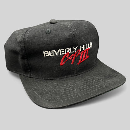 Raree Finds vintage 1994 Beverly Hills Cop III black snapback hat with red and white embroidered movie logo