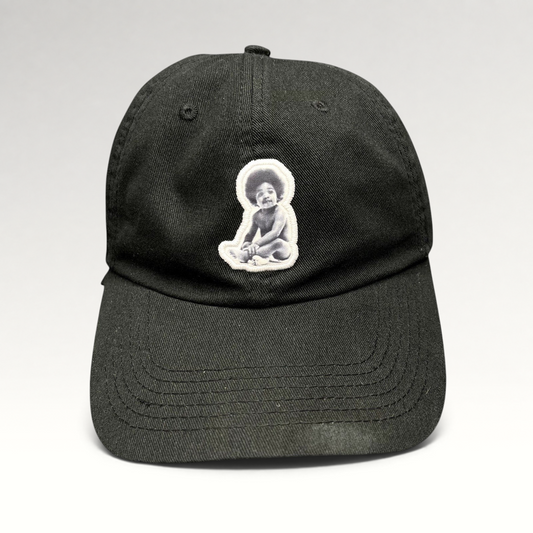 Raree Finds black strapback hat featuring an embroidered Notorious B.I.G. Ready To Die baby graphic patch