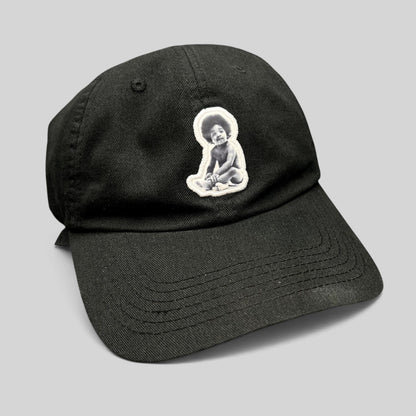 Raree Finds black strapback hat featuring a Ready To Die baby graphic patch inspired by The Notorious B.I.G.