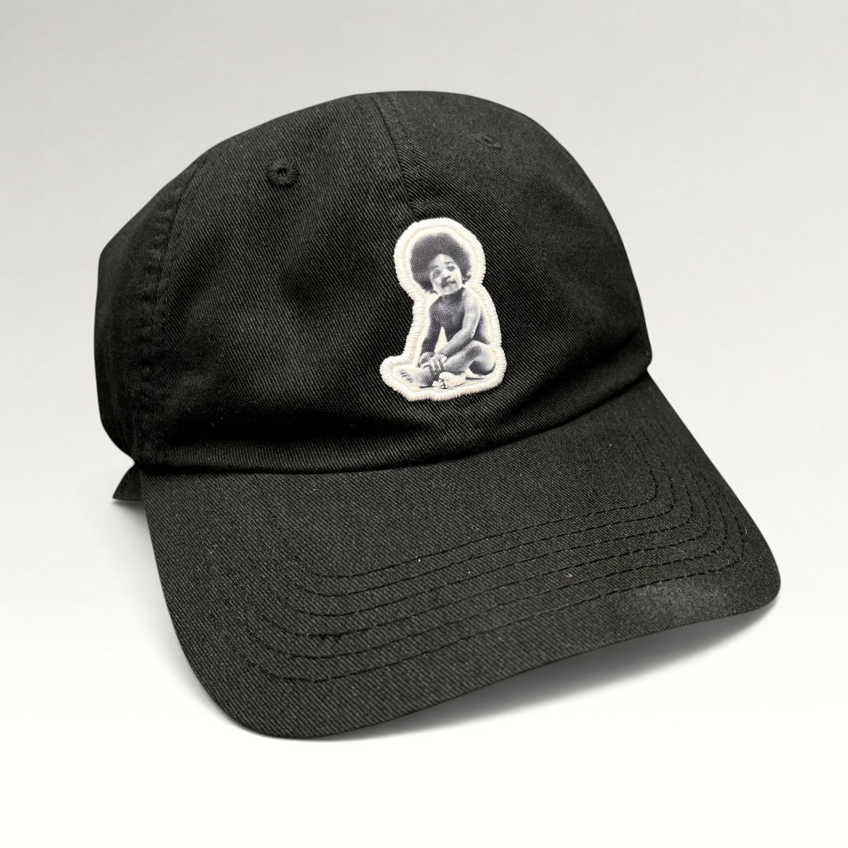 Raree Finds black strapback hat featuring a Ready To Die baby graphic patch inspired by The Notorious B.I.G.