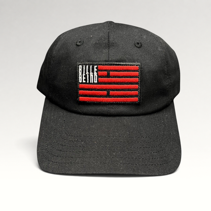 Raree Finds BilleBeino black strapback hat with a red embroidered flag logo patch and curved brim