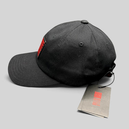Raree Finds BilleBeino black strapback hat with red embroidered flag logo and original tags attached