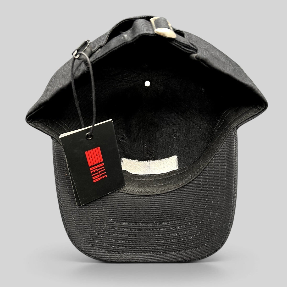 Raree Finds BilleBeino black strapback hat with adjustable metal buckle and attached brand tag