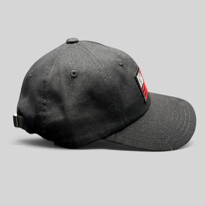 Raree Finds BilleBeino black strapback hat with red embroidered flag logo and adjustable metal buckle closure