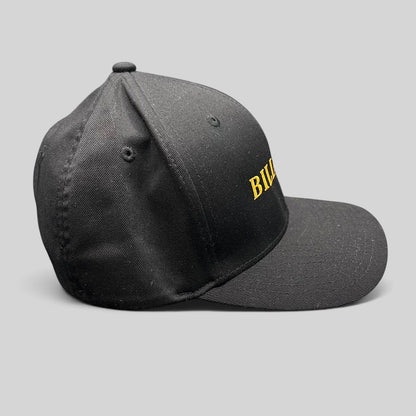 Raree Finds Billions TV show black Yupoong Flexfit hat with gold embroidered logo on a structured crown
